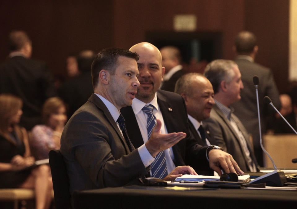 Acting U.S. Homeland Security Secretary Kevin McAleenan, left, and Rolando Mirones, center, Panama's Security Minister speaks during a meeting with Central American and Colombian security ministers in Panama City, Thursday, Aug. 22, 2019. McAleenan is in Panama to discuss drug trafficking and migrant smuggling, though he says he isn't seeking any specific agreement during the visit. (AP Photo/Arnulfo Franco)