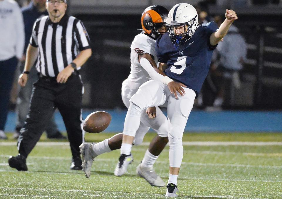 McDowell High School senior Alex Sontheimer gets off a punt under pressure against Cathedral Prep at Gus Anderson Field in Millcreek Township on Sept. 29, 2023.