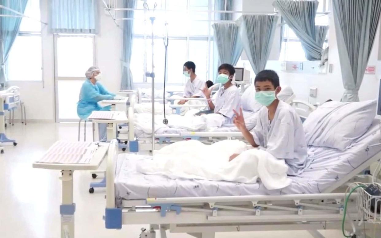 The boys rescued from the Thai cave wearing mask and resting in a hospital in Chiang Rai, Thailand - REUTERS