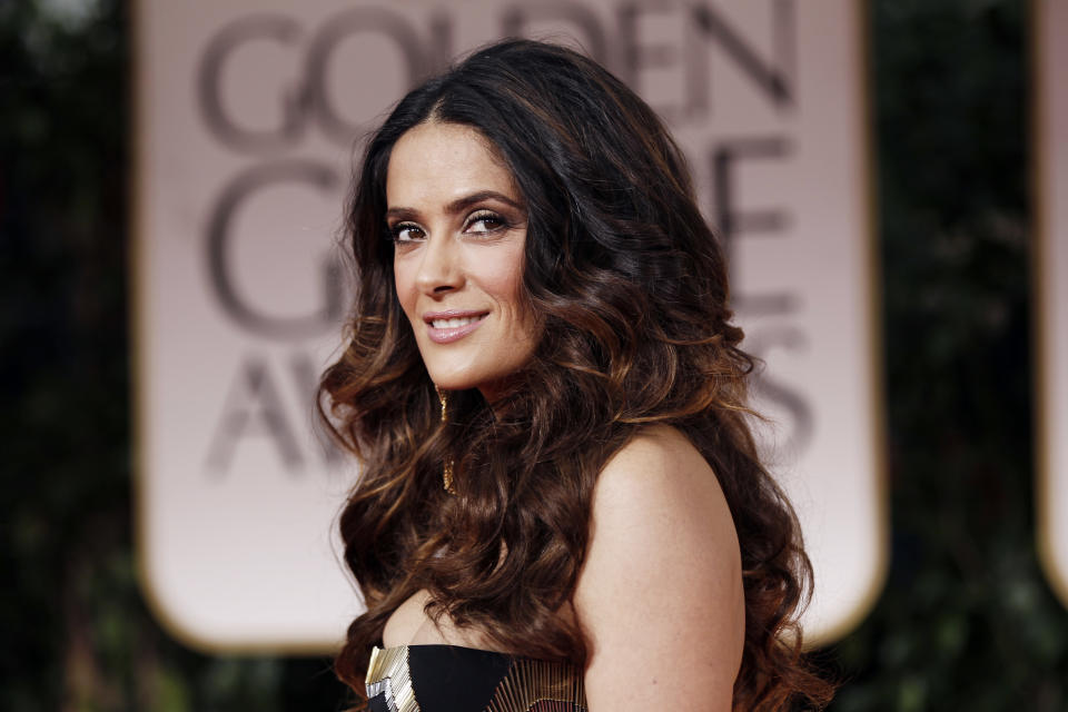 Salma Hayek arrives at the 69th Annual Golden Globe Awards Sunday, Jan. 15, 2012, in Los Angeles. (AP Photo/Matt Sayles)