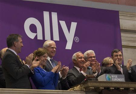 Ally Financial CEO Michael Carpenter (C ) and company executives ring the opening bell to celebrate Ally Financial Inc. REUTERS/Brendan McDermid