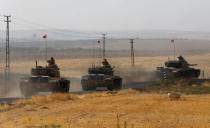 Turkish army tanks drive towards to the border in Karkamis on the Turkish-Syrian border in the southeastern Gaziantep province, Turkey, August 25, 2016. REUTERS/Umit Bektas