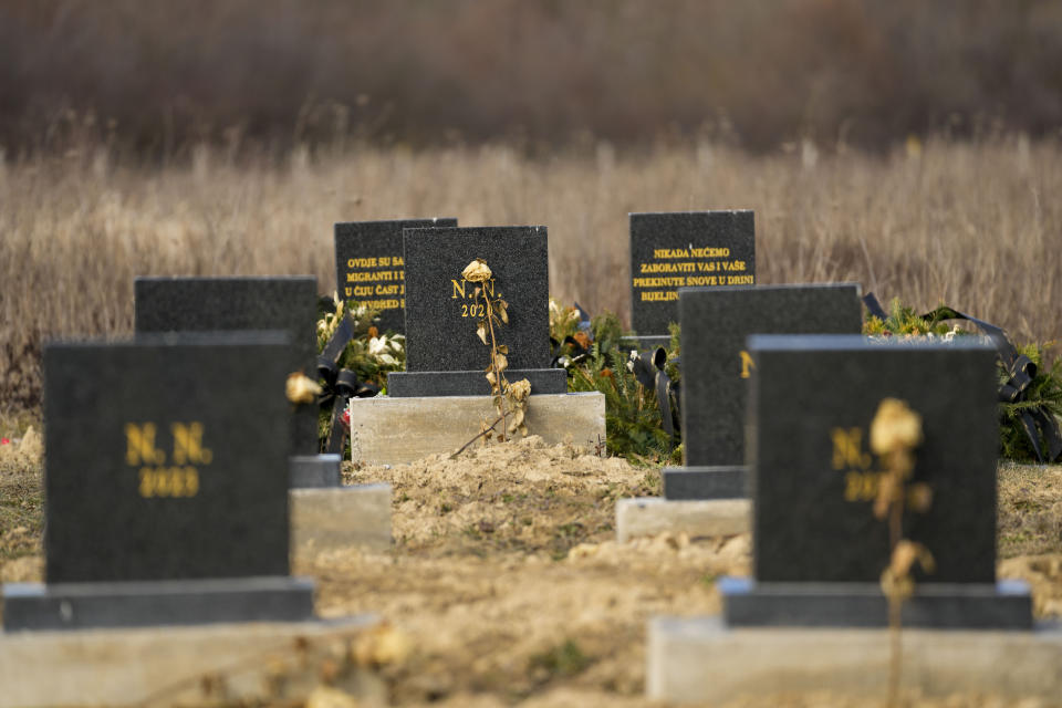 The gravestones under which unidentified remains of 41 people retrieved from the river since 2017, are seen at the cemetery in Bijeljina, eastern Bosnia, Sunday, Feb. 4, 2024. In several cities along this river between Bosnia and Serbia, simple, durable gravestones now mark the final resting places of dozens of refugees and migrants who drowned in the area while trying to reach Western Europe. (AP Photo/Darko Vojinovic)