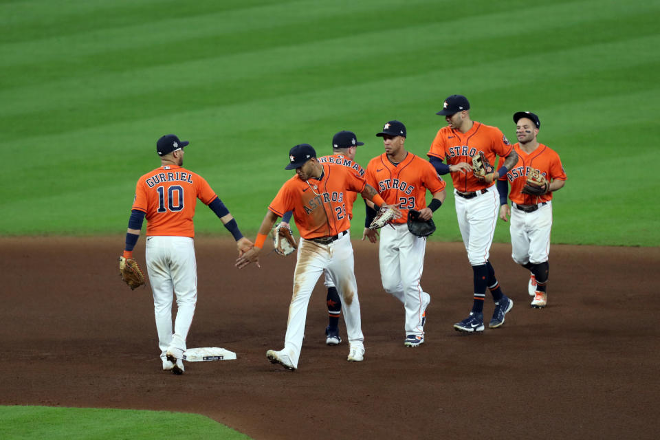 HOUSTON, TX - OCTOBER 27:  Yuli Gurriel #10, Alex Bregman #2, Jose Siri #26, Michael Brantley #23, Carlos Correa #1 and Jose Altuve #27 of the Houston Astros celebrate a 7-2 win over the Braves in Game 2 of the 2021 World Series between the Atlanta Braves and the Houston Astros at Minute Maid Park on Wednesday, October 27, 2021 in Houston, Texas. (Photo by Michael Starghill/MLB Photos via Getty Images)