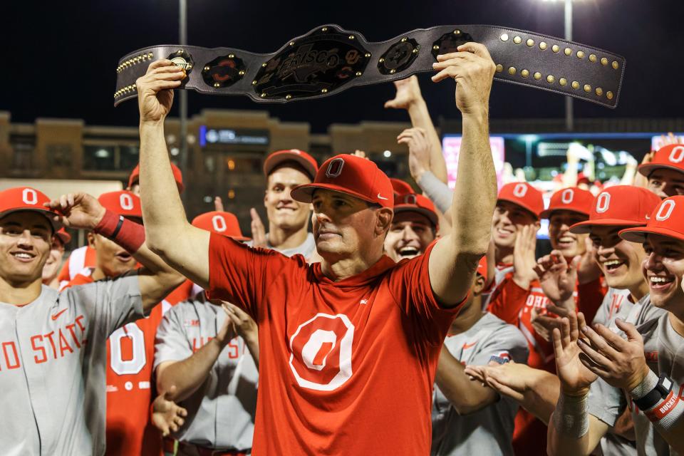 Ohio State coach Bill Mosiello celebrated the Buckeyes' Frisco College Baseball Classic win with the team's award: a wrestling belt.  (Photo/Jay LaPrete)