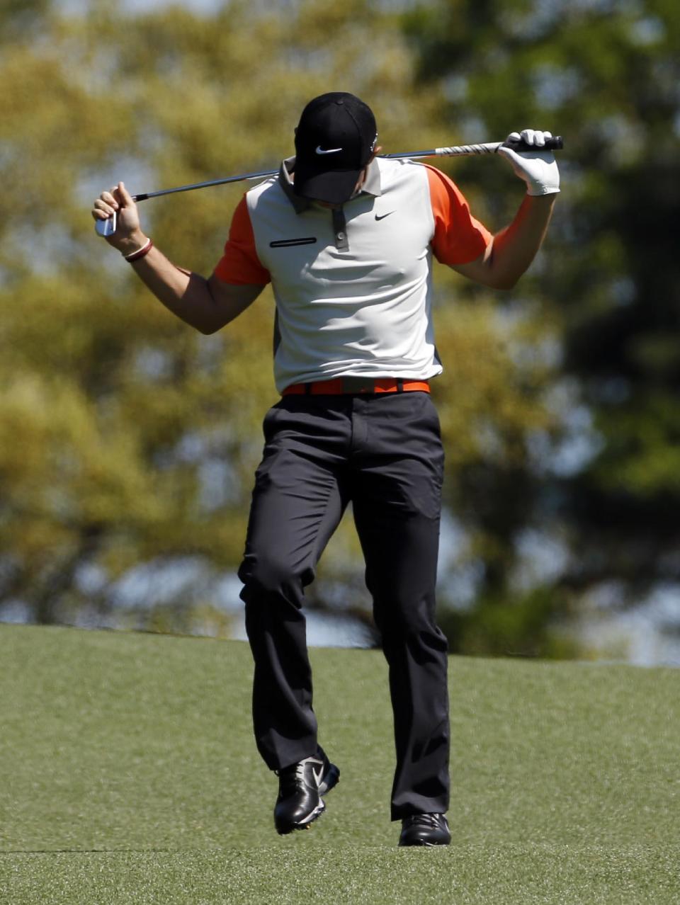 Rory McIlroy, of Northern Ireland, reacts to his shot on the third fairway during the first round of the Masters golf tournament Thursday, April 10, 2014, in Augusta, Ga. (AP Photo/Matt Slocum)