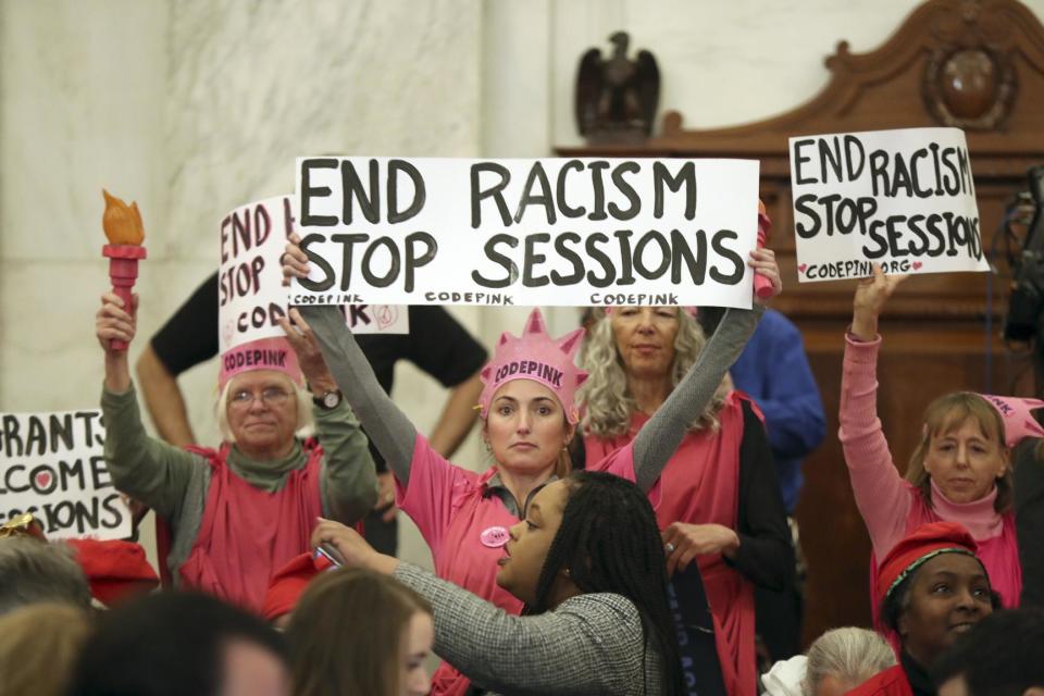 Protestors from CodePink, including co-founder Medea Benjamin take part in a demonstration on Capitol Hill in Washington, Tuesday, Jan. 10, 2017, during Senate Judiciary Committee's confirmation hearing for Attorney General-designate, Sen. Jeff Sessions, R-Ala. (AP Photo/Andrew Harnik)