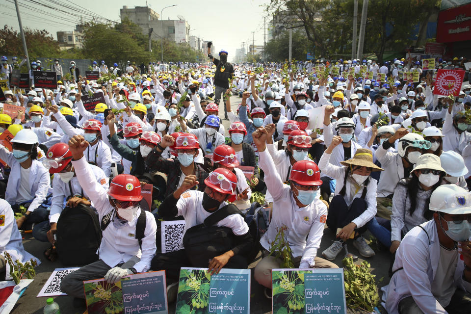 Protesters shout slogans during a protest against the military coup in Mandalay, Myanmar, Sunday, Feb. 28, 2021. In the month since the Feb. 1 coup, the mass protests occurring each day are a sharp reminder of the long and bloody struggle for democracy in a country where the military ruled directly for more than five decades. (AP Photo)