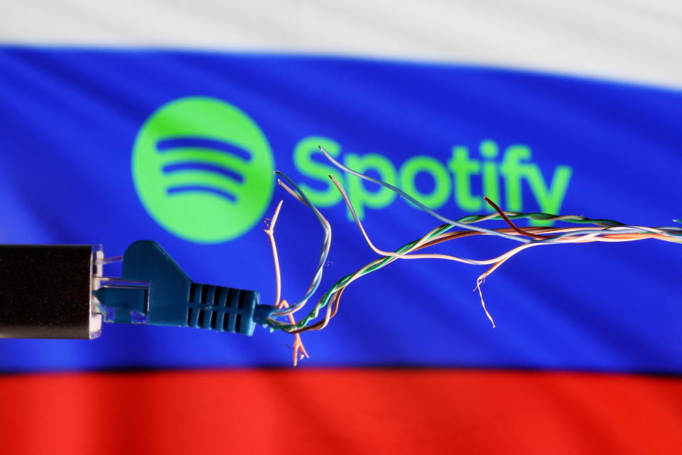 Broken Ethernet cable is seen in front of Russian flag and Spotify logo in this illustration taken March 11, 2022. REUTERS/Dado Ruvic/Illustration