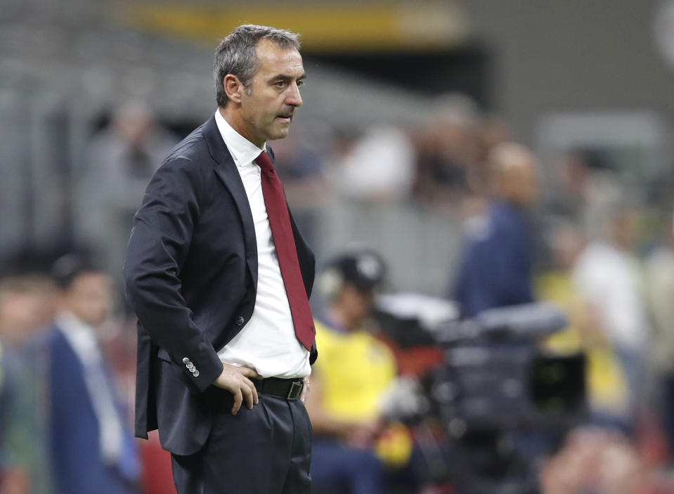 AC Milan's manager Marco Giampaolo follows the game during a Serie A soccer match between AC Milan and Fiorentina, at the San Siro stadium in Milan, Italy, Sunday, Sept. 29, 2019. (AP Photo/Antonio Calanni)