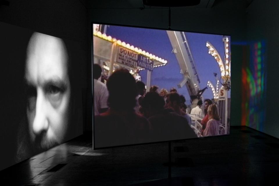 A Bill Viola video installation, "Slowly Turning Narrative," 1992: a pensive face plus street scenes.