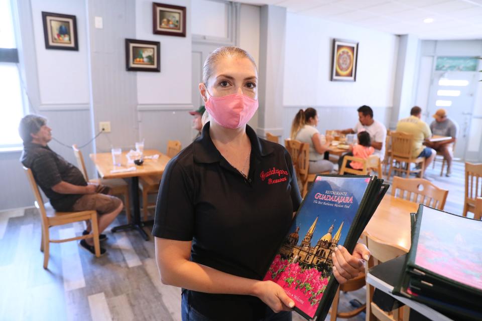 Fabiola Estrada, center, helps her mother manage Guadalajara Mexican Restaurant, 901 S. 10th St. in Milwaukee.