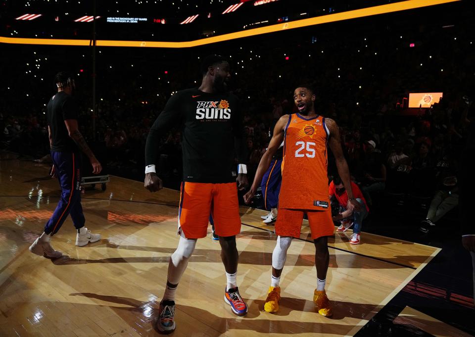 Mar. 18, 2022;  Phoenix, AZ, USA; Suns' Mikal Bridges (R) and Deandre Ayton dances before the game against the Bulls at the Footprint Center.