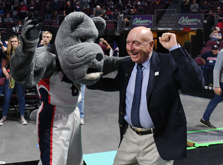 LAS VEGAS, NEVADA - MARCH 10: Sportscaster Dick Vitale dances with the Gonzaga Bulldogs mascot Spike.