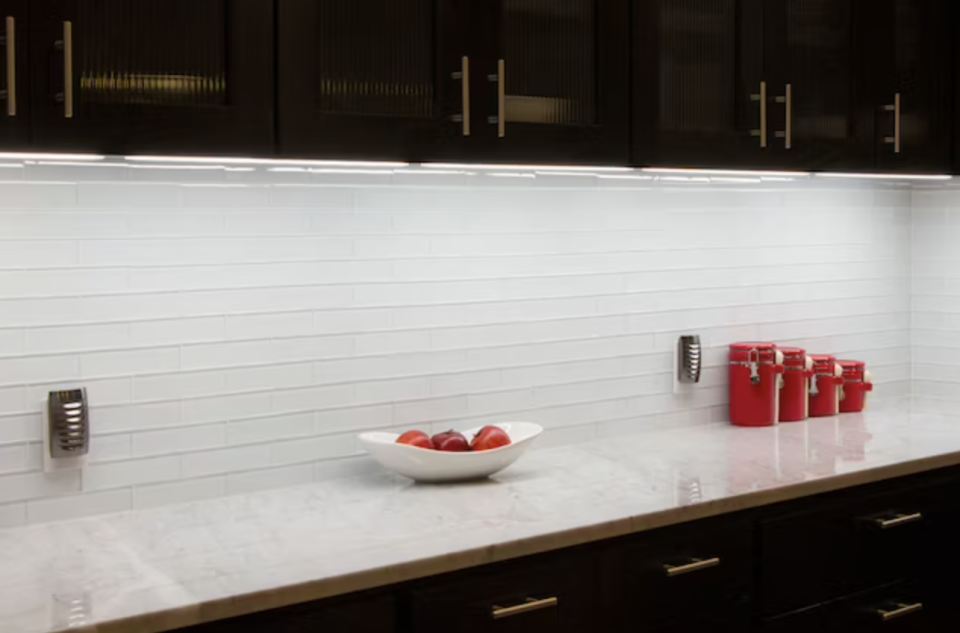 under-cabinet light under white kitchen counter