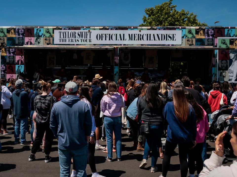 Hundreds stood in line for hours to get their official Taylor Swift merchandise before the pop star's weekend concerts at Gillette Stadium.