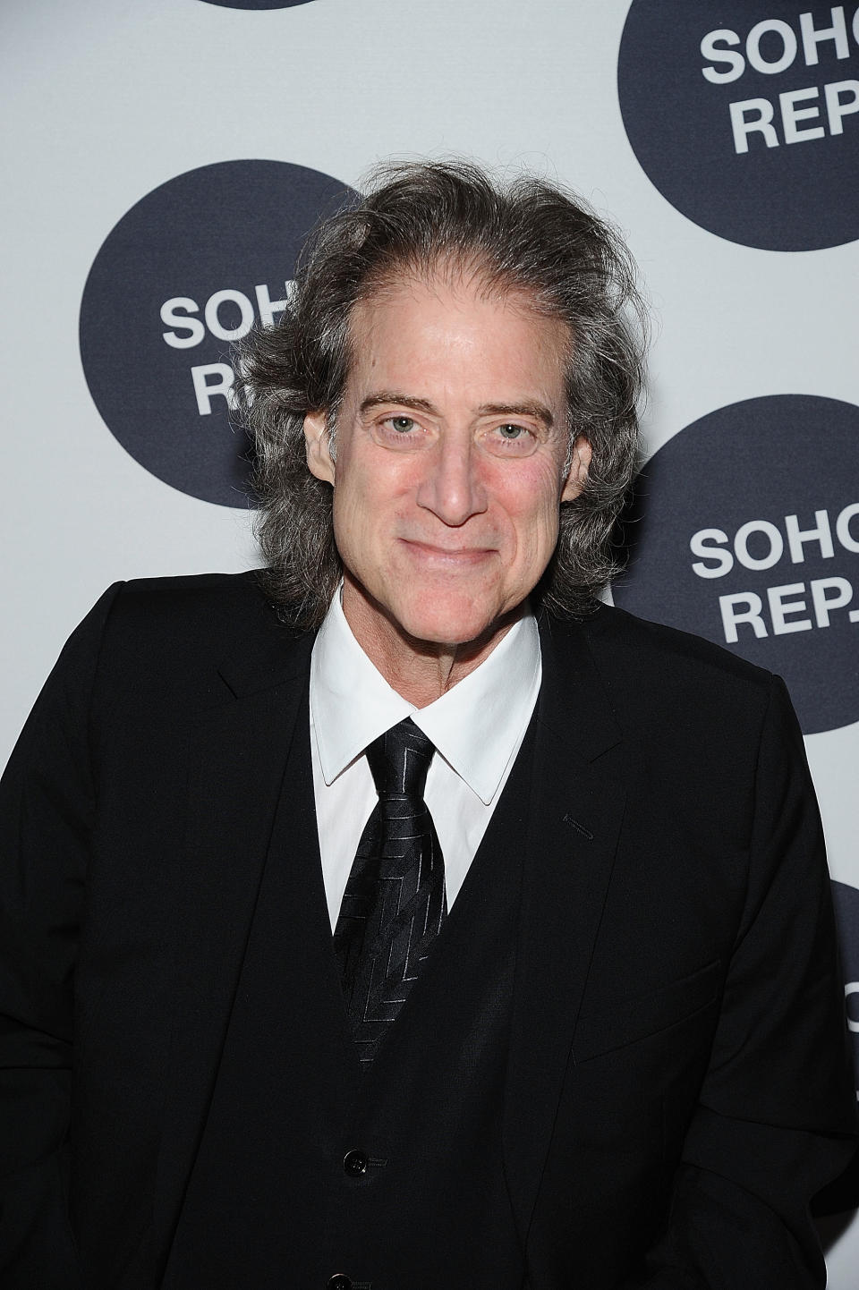 Richard Lewis (pictured in 2014) was 76 when he died of a heart attack. (Image via Getty Images)