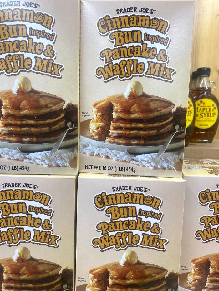 Boxes of Trader Joe's Cinnamon Bun Inspired Pancake & Waffle Mix on a shelf