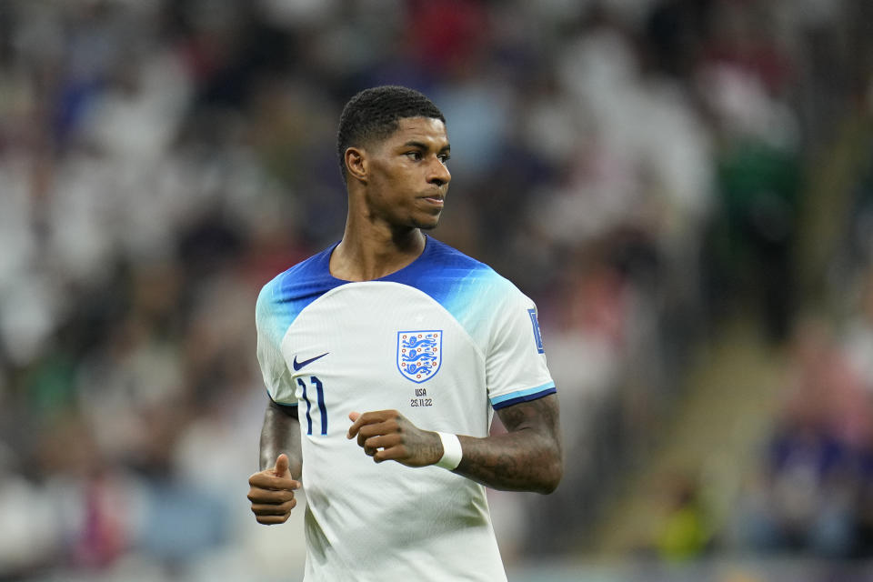 England's Marcus Rashford runs on the pitch during the World Cup group B soccer match between England and The United States, at the Al Bayt Stadium in Al Khor , Qatar, Friday, Nov. 25, 2022. (AP Photo/Julio Cortez)