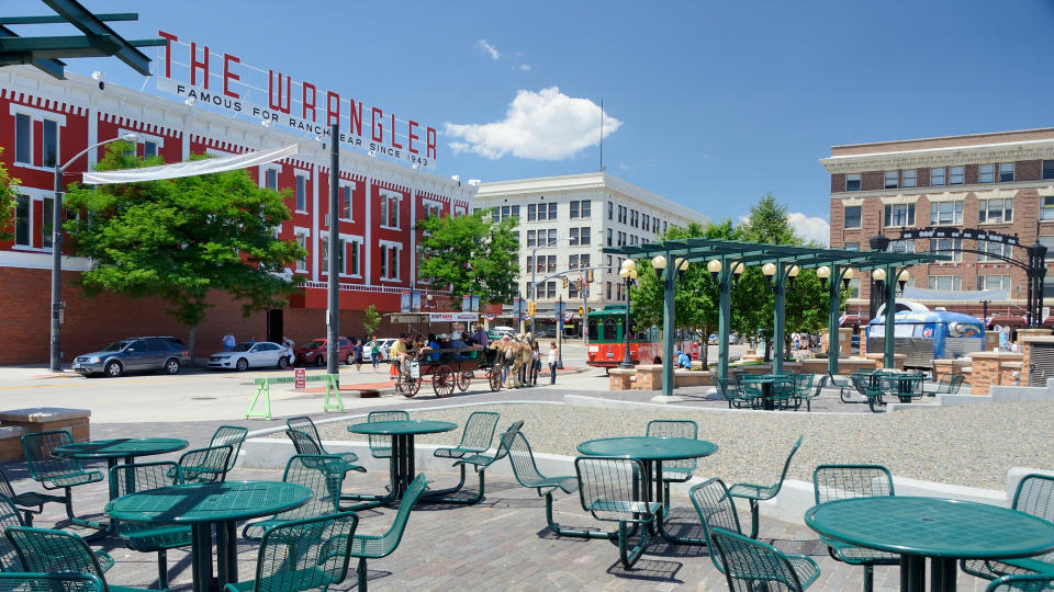 Cheyenne, Wyoming, USA - July 21, 2013: People on a horse drawn carriage in downtown Cheyenne.