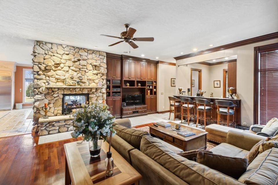 The more casual family room includes a bar.