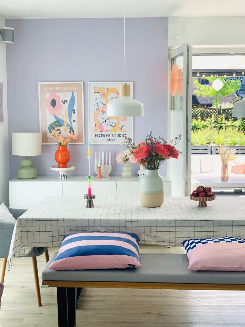 kitchen table, bench, coral vase, flowers, airy, table cloth, open doors, wood floors, striped pillows