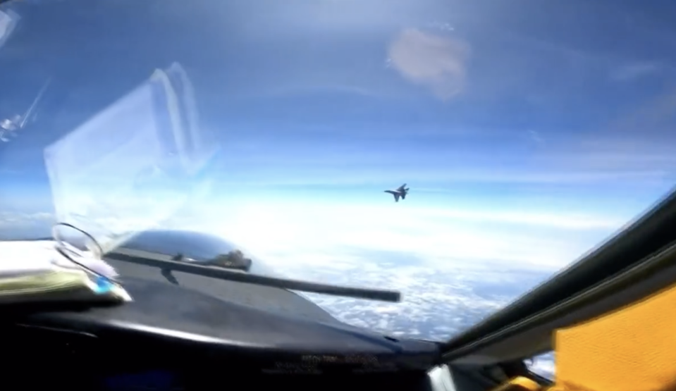 View from the US jet cockpit shows the Chinese fighter passing close by.