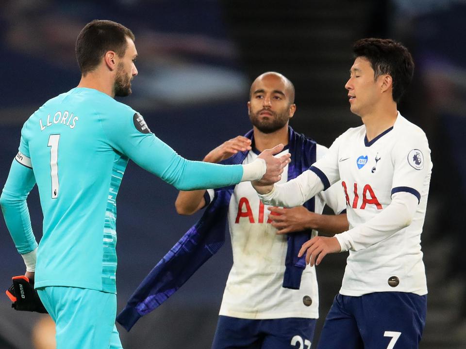 Lloris and son embrace at full-time: Getty