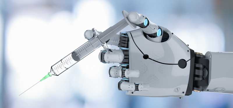 A robotic arm holds a syringe.