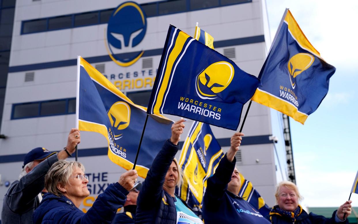 Worcester Warriors fan wave flags outside Sixways stadium - Worcester blame game proves need for financial transparency in Premiership