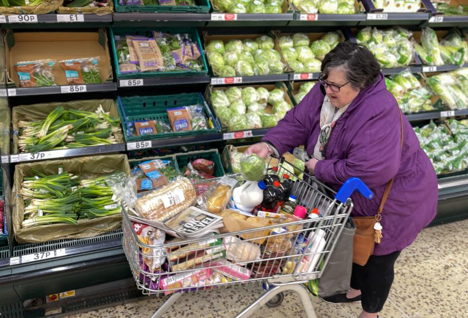 A customer shops for food items inside a Tesco supermarket store in east London on January 10, 2022. - UK annual inflation rocketed last November to 5.1 percent, more than double the Bank of England's 2.0-percent target -- price rises for fuel, clothing, food, second-hand cars and increased tobacco duty all helped drive up inflation. (Photo by Daniel LEAL / AFP) (Photo by DANIEL LEAL/AFP via Getty Images)