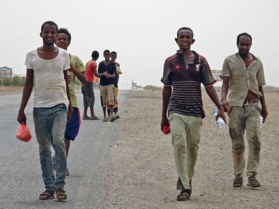 African asylum seekers walk in the coastal area of Ras al-Ara in Yemen’s government-held southern province of Lahij  (Khaled Ziad/AFP via Getty Images)