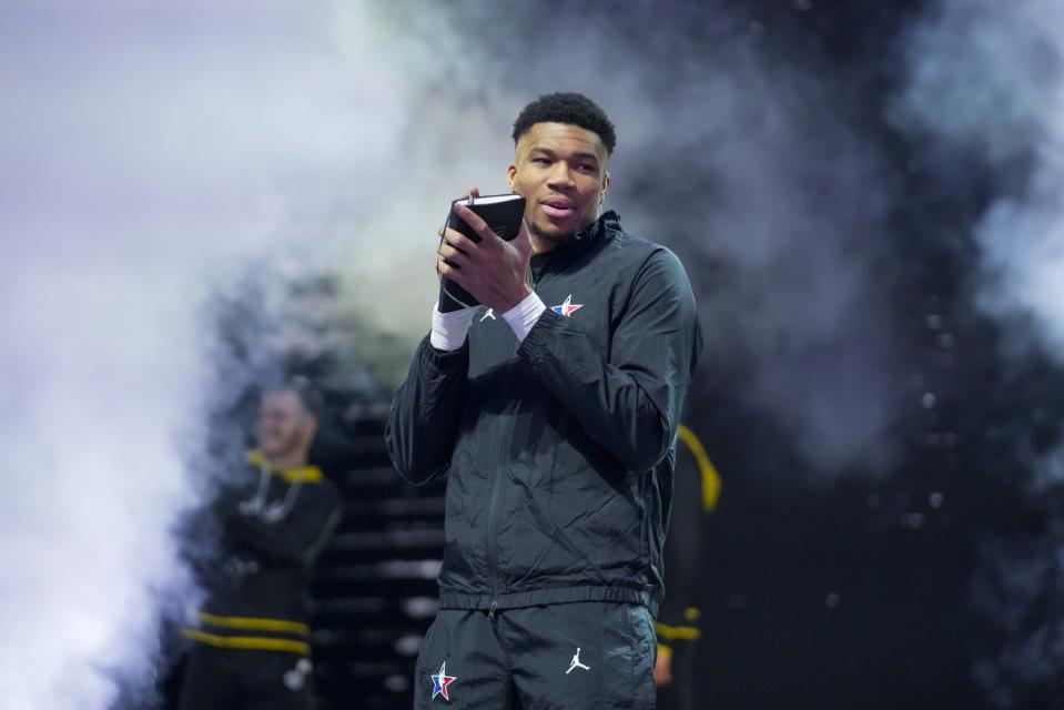 Giannis Antetokounmpo smiles as he picks his team before the NBA basketball All-Star game Sunday, Feb. 19, 2023, in Salt Lake City. (AP Photo/Rick Bowmer)