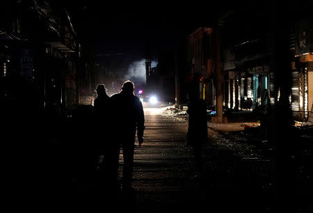 Villagers stand outside their damaged houses following an explosion at a pesticide plant owned by Tianjiayi Chemical, in Xiangshui county, Yancheng, Jiangsu province, China March 22, 2019. REUTERS/Aly Song