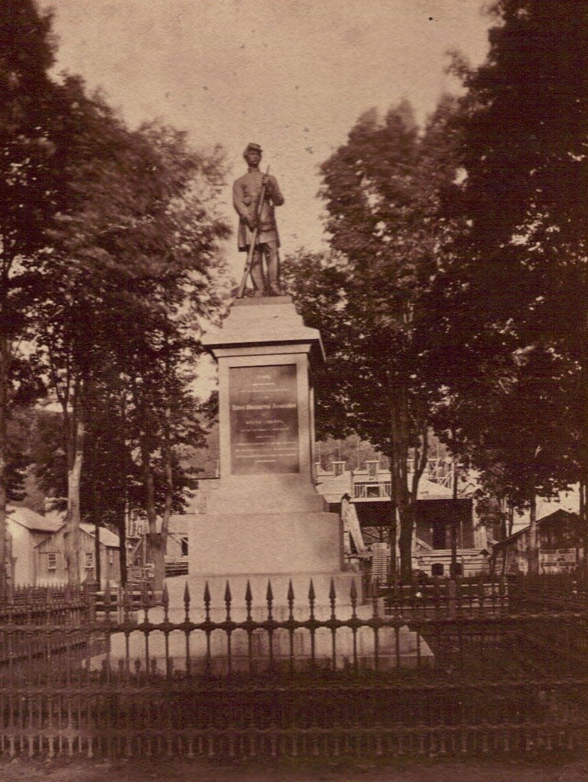 Apparently taken some time in 1878-1879, construction for the new Wayne County Courthouse is in the background, as seen from Central Park in Honesdale. The Civil War memorial was dedicated in 1869.