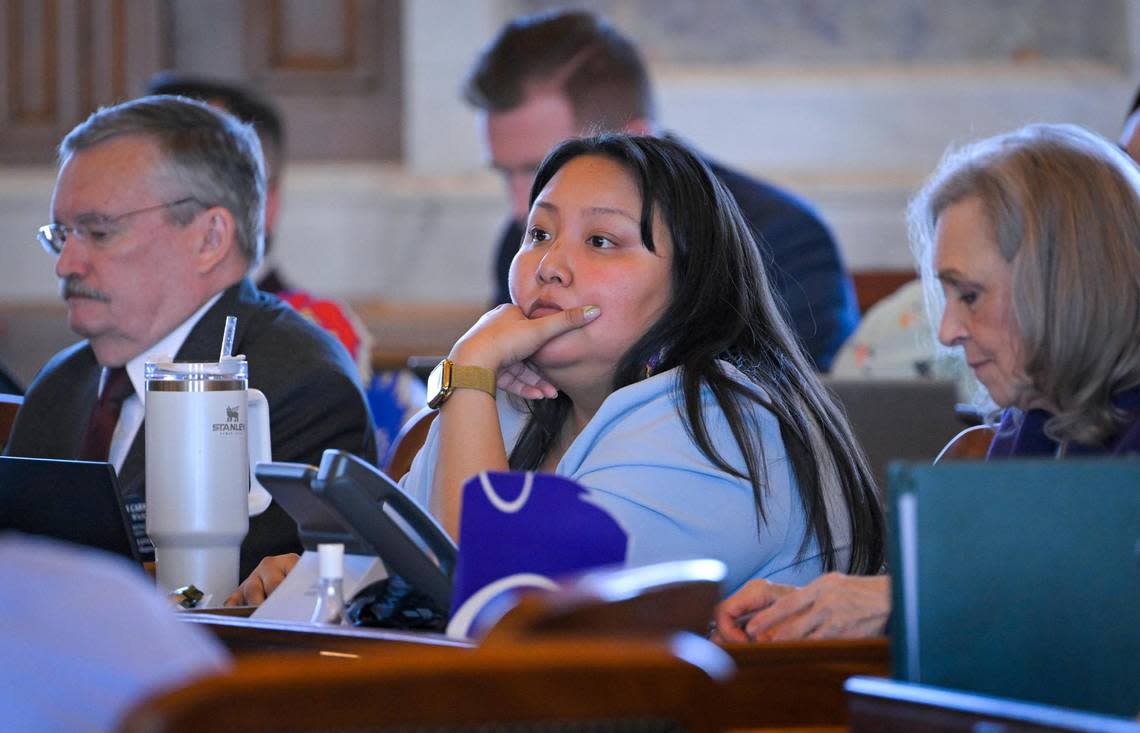 Rep. Christina Haswood, a Democrat from Lawrence, center, listened as education issues were debated in the Kansas House on Tuesday in Topeka. Haswood, who is popular on Tik Tok with 144,600 followers, said she has found paid speaking engagements at colleges and is participating in a fellowship.