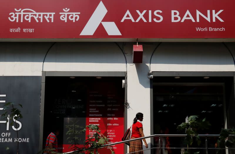 A customer enters a branch of Axis Bank in Mumbai