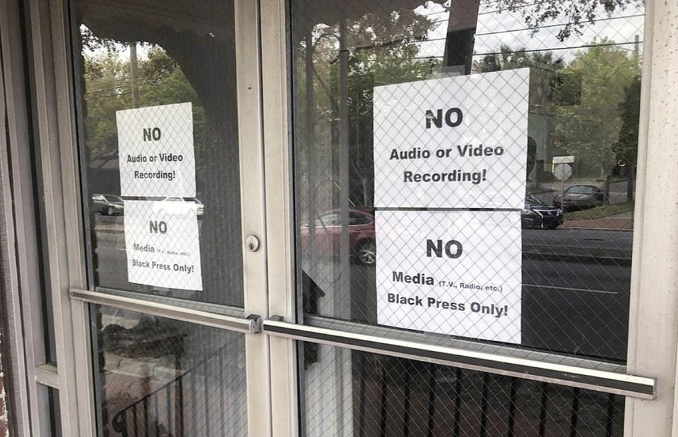 In this Wednesday, March 27, 2019 photo, signs posted on the doors of the Bolten Street Baptist Church are seen during a meeting coordinated to garner support for one black candidate in Savannah's mayoral race, in Savannah, Ga. Organizers of a meeting to discuss an upcoming mayoral race in Georgia barred reporters from attending, unless they were African-American. (Eric Curl/Savannah Morning News via AP)