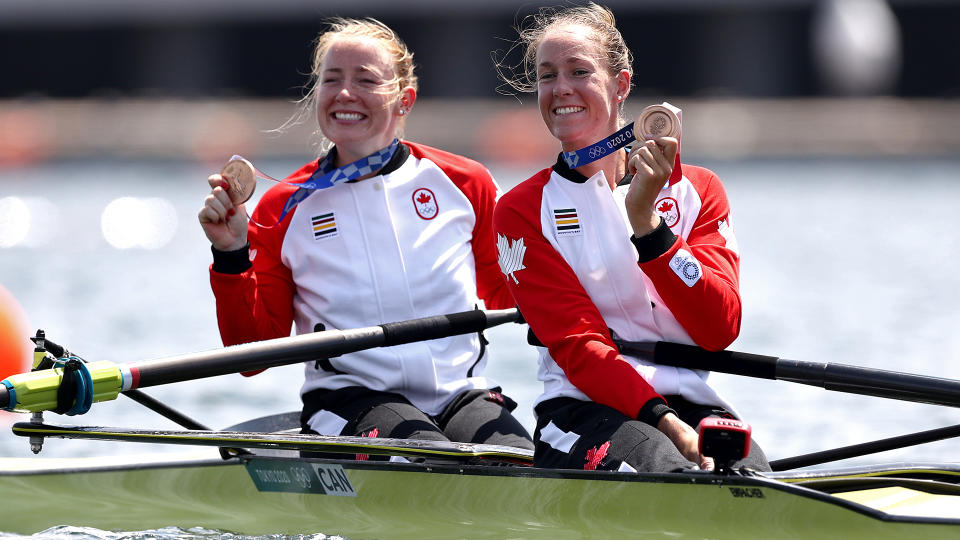 TOKYO, JAPAN - JULY 29:  Bronze medalists Caileigh Filmer and Hillary Janssens of Team Canada pose with their medals following the medal ceremony for the Women's Pair Final A on day six of the Tokyo 2020 Olympic Games at Sea Forest Waterway on July 29, 2021 in Tokyo, Japan. (Photo by Maja Hitij/Getty Images)