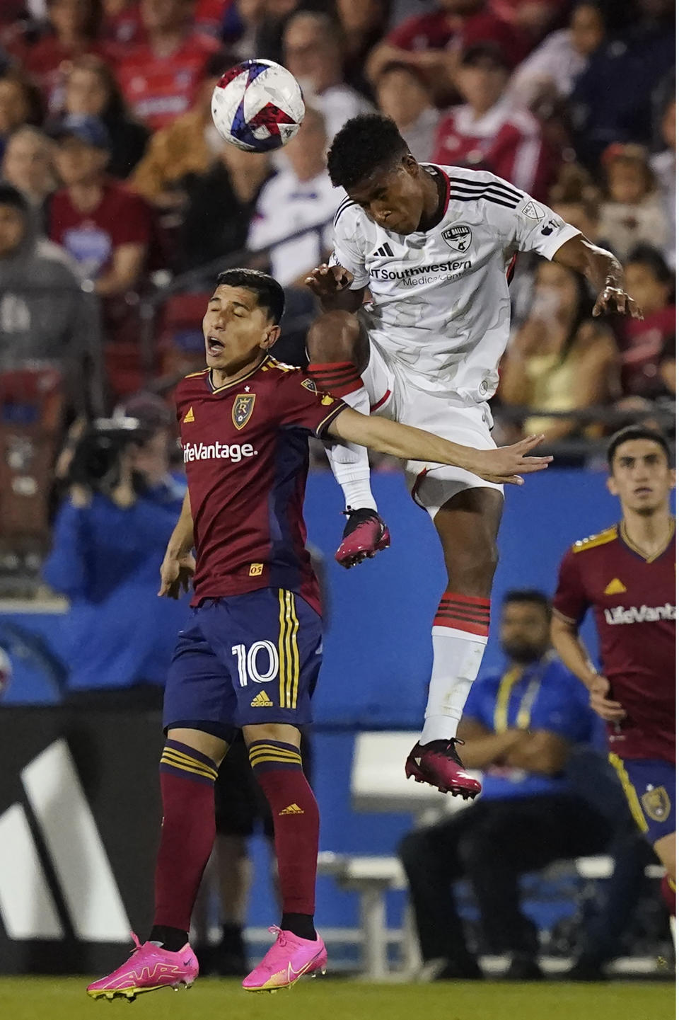 FC Dallas defender Geovane Jesus, right, goes up for a header against Real Salt Lake forward Jefferson Savarino (10) during the second half of an MLS soccer match Saturday, April 15, 2023, in Frisco, Texas. (AP Photo/LM Otero)