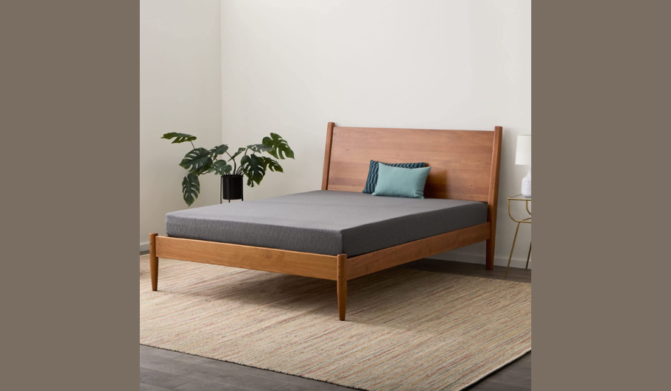 mattress on bed frame in bedroom
