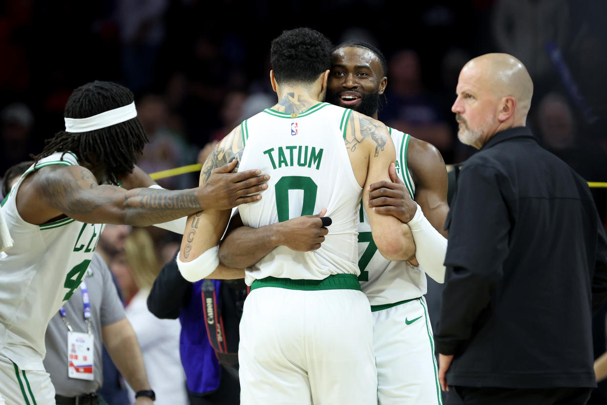 Jaylen Brown embraces Boston Celtics co-star Jayson Tatum after their Game 6 victory against the Philadelphia 76ers in the Eastern Conference semifinals. (Photo by Tim Nwachukwu/Getty Images)