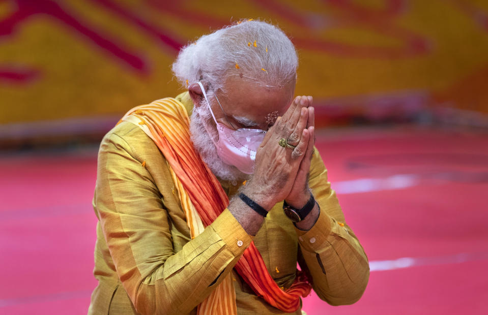 Indian Prime Minister Narendra Modi performs rituals during the groundbreaking ceremony of a temple dedicated to the Hindu god Ram, in Ayodhya, India, Wednesday, Aug. 5, 2020.