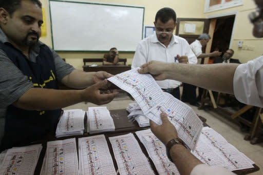 Egyptian election officials count ballots at a polling station in Cairo. Vote counting was underway in Egypt after two days of polling ended Thursday in a landmark presidential election which pitted stability against the ideals of the uprising that ended Hosni Mubarak's rule