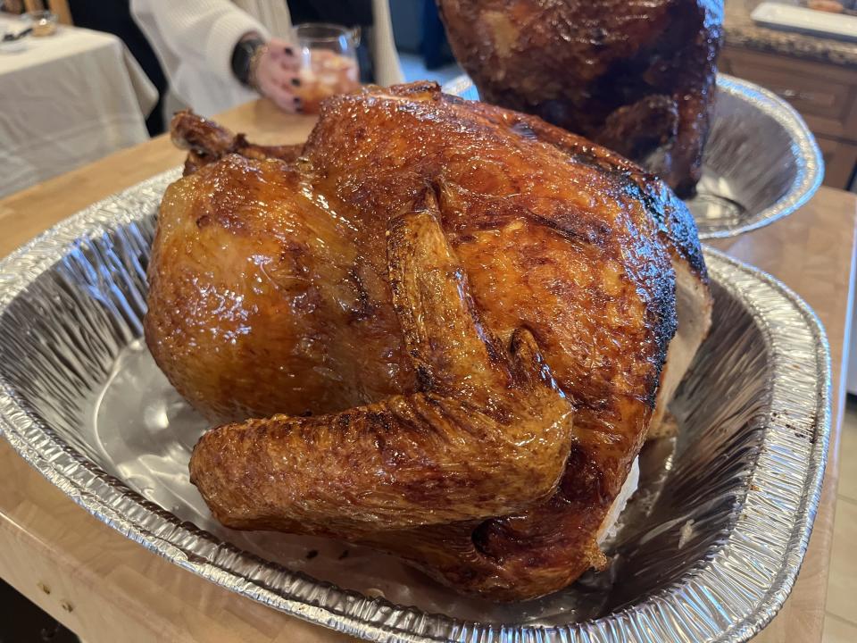 a deep fried turkey in a foil tray