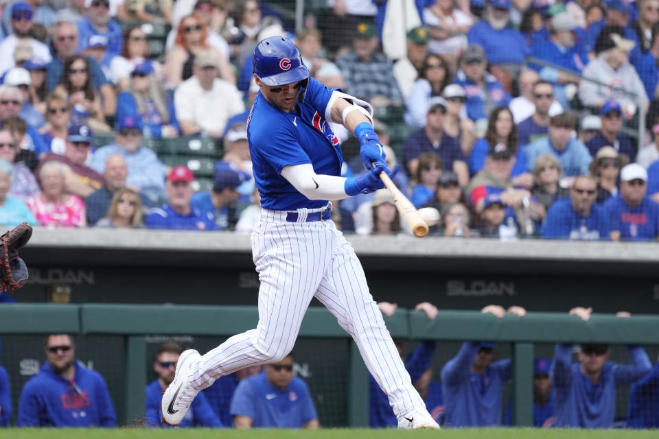 Chicago Cubs' Nico Hoerner connects for a single against the Arizona Diamondbacks during the first inning of a spring training baseball game Thursday, March 16, 2023, in Mesa, Ariz. (AP Photo/Ross D. Franklin)