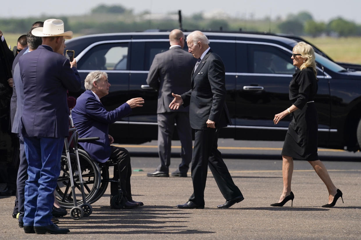 President Biden and Jill Biden approach Texas Gov. Greg Abbott to shake hands.