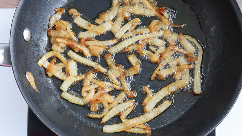 onions browning in skillet