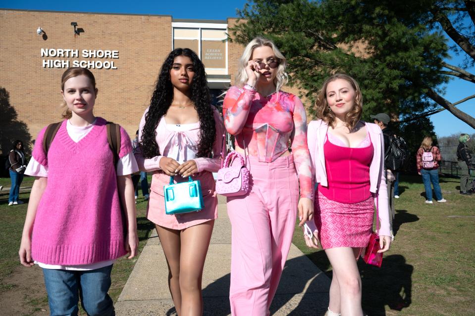 Cady (Angourie Rice, far left) falls in with the clique-y Plastics – Karen (Avantika), Regina (Renee Rapp) and Gretchen (Bebe Wood) – in the musical "Mean Girls."