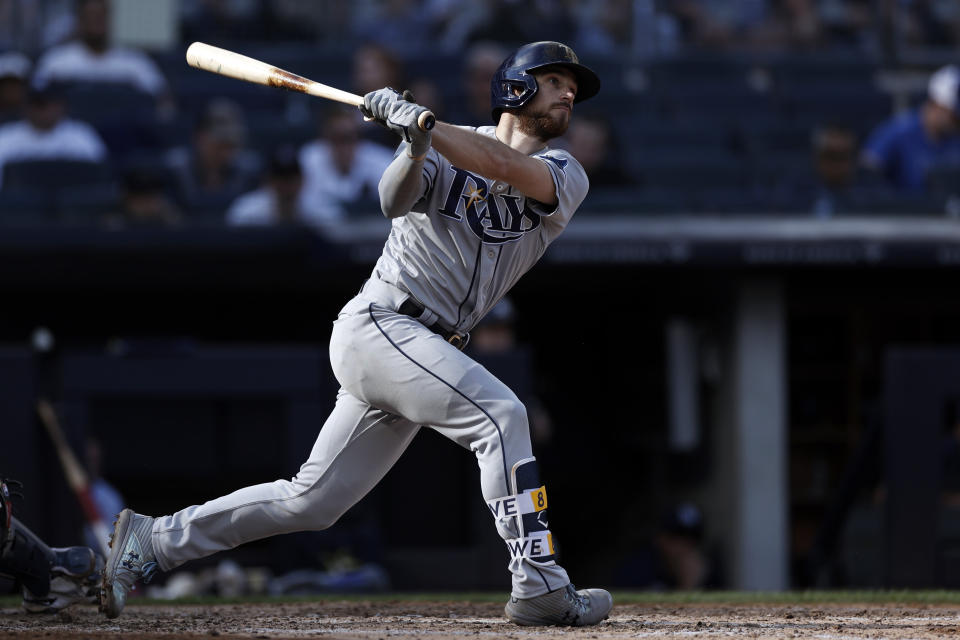 Tampa Bay Rays' Brandon Lowe hits a home run during the seventh inning of a baseball game against the New York Yankees on Saturday, Oct. 2, 2021, in New York. (AP Photo/Adam Hunger)